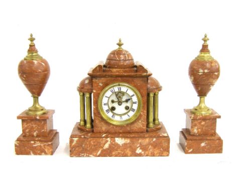 Rouge marble two train mantel clock garniture, the A D. Mougin movement striking on a gong, the 3.75" dial with recessed visi