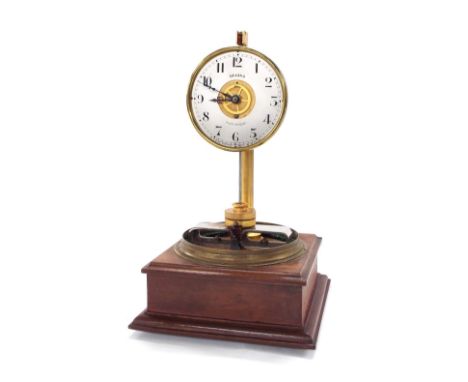 Regina electric clock, the 3.5" silvered dial enclosing a gilded centre, supported upon a square stepped mahogany base and un