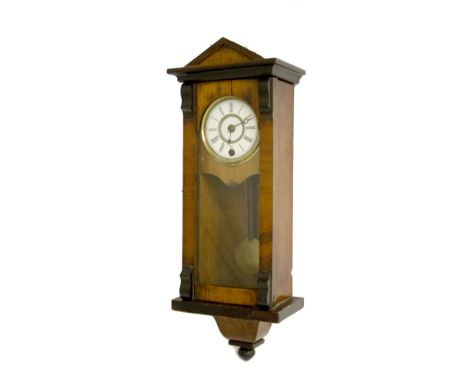 Miniature walnut and ebonised Vienna regulator single train wall clock, the 3" white dial within a glazed case surmounted by 