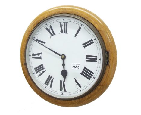 Light oak single fusee 12" wall dial clock, within a turned surround
