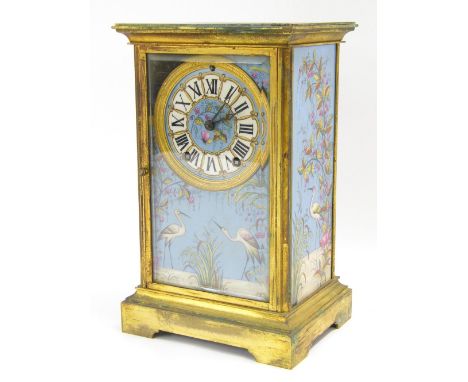 Brass porcelain panelled two train mantel clock, the American movement with outside countwheel striking on a gong, the 3.75" 