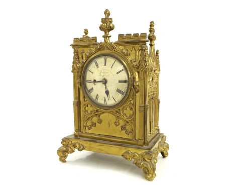 Gothic brass single fusee mantel clock, the 5" silvered convex dial signed Feltham, Swaffham, within an ornate castellated ca