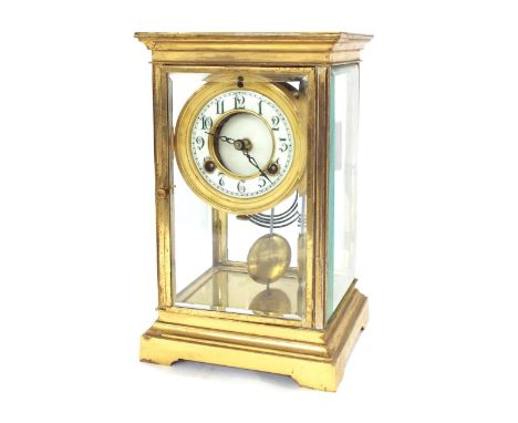 American brass four glass two train mantel clock, the movement signed Waterbury Clock Co, USA striking on a gong, the 2.75" d