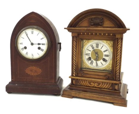 Junghans walnut two train mantel clock, the 5" square brass dial within a carved arched stepped case, 14.25" high; together w