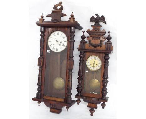 Walnut two train Vienna wall clock, the 8" dial within a glazed pillared case; together with a smaller two train Vienna wall 