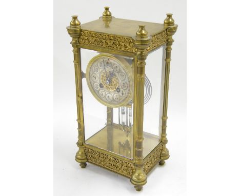 French brass four glass two train mantel clock striking on a gong, the 3.5" silvered chapter ring enclosing a gilt filigree c