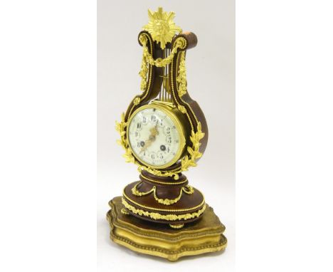 French gilt metal and stained wooden two train lyre mantel clock striking on a bell, the 3.75" cream dial within a drumhead c