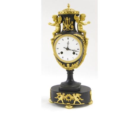 Bronze and ormolu two train urn mantel clock, the movement with outside countwheel striking on a bell (missing), the 3.5" ena