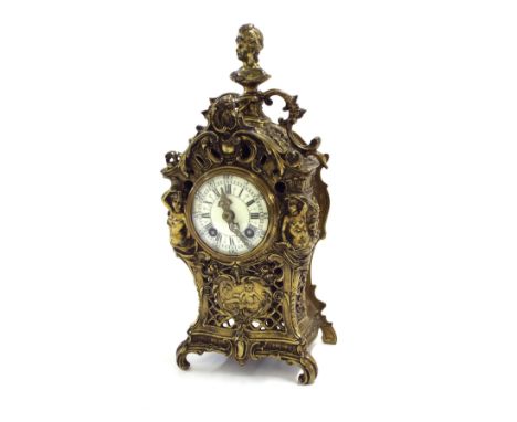 Small French gilt metal two train mantel clock, the movement striking on a bell, the 2.5" cream dial within an ornate pierced