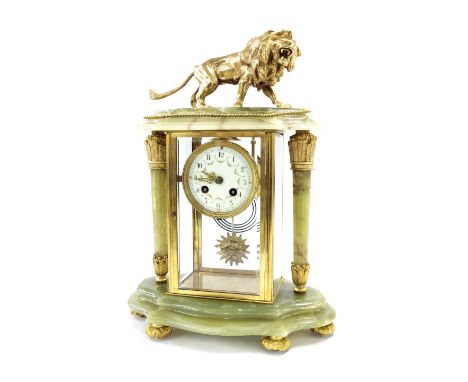 Green onyx and ormolu mounted four glass two train mantel clock striking on a gong, the 3.25" dial within a bevelled glazed p