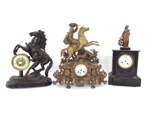 Two train black slate figural mantel clock, 18.75" high; together with two spelter figural mantel clocks of equestrian intere