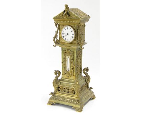 Novelty brass mantel timepiece in the form of a longcase clock, the 2.25" white dial within a foliate embossed and pierced br