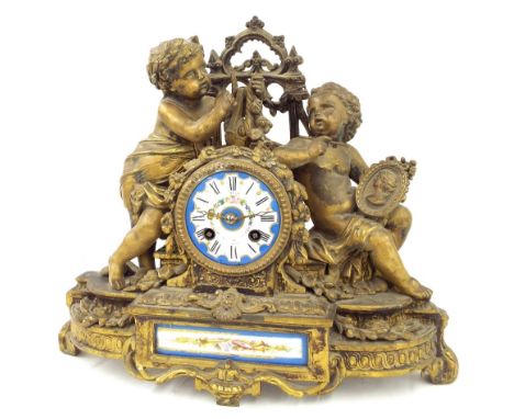 Gilt metal porcelain mounted two train figural mantel clock, the movement with outside countwheel striking on a bell, the 3" 