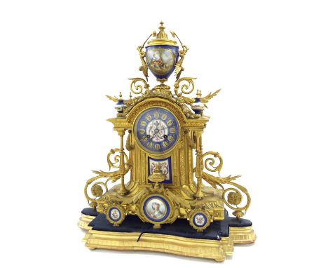 Ormolu and porcelain two train mantel clock, the movement with outside countwheel striking on a bell, the 3.75" porcelain dia