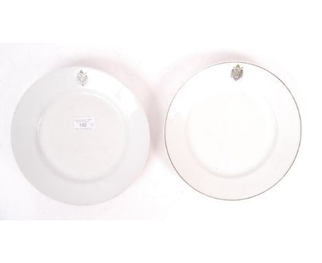 A pair of WWI First World War Imperial German Navy related ceramic plates - both with the German Imperial eagle emblem to top