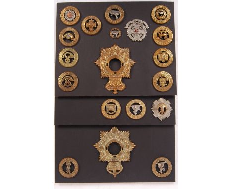 An incredible collection of assorted period original British Army uniform cap badge helmet plates and centres. Includes centr