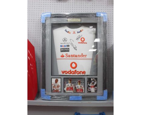 Lewis Hamilton &amp; Jenson Button Autographs, black pen signed (unverified) on a Vodafone white shirt with other sponsors, a