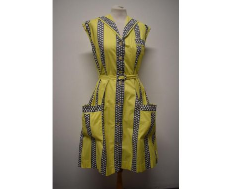 A rather fun 1950s cotton day dress, in medium weight cotton, having bands of grey with white polka dots on yellow ground, ov