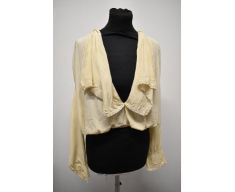 An Edwardian cream silk blouse, having large statement collar edged with lace and blouson bodice, full length sleeves with la