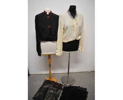 An early 20th century black blouse with fancy red buttons and embroidery to collar, a 1960s cream St Michaels Tricel georgett