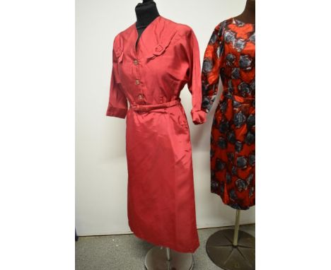 A late 1940s cerise taffeta dress having amazing novelty buckle details to shoulders, pockets to sides of fitted skirt and or