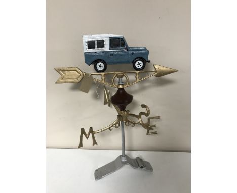 A cast iron Land Rover weather vane and mount 