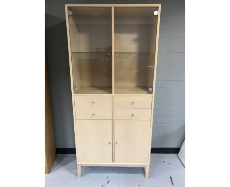 A contemporary beech glazed door cabinet 