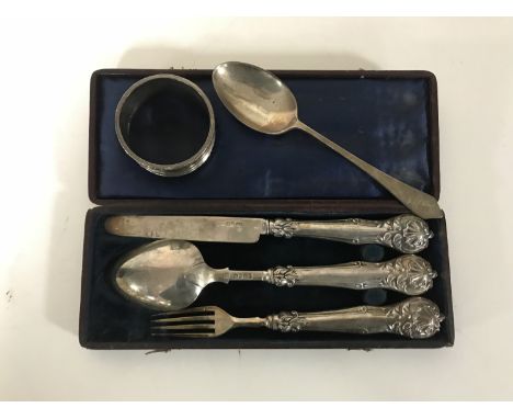 A silver knife fork and spoon in case, silver napkin ring and teaspoon 