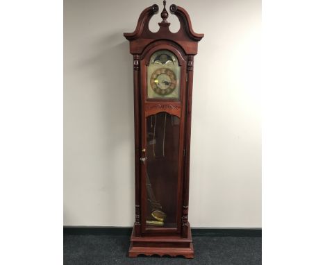 A Heritage longcase clock with brass dial 