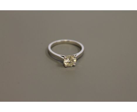 An 18ct white gold diamond solitaire ring, the brilliant cut stone weighing an estimated 1.25 carat, size N CONDITION REPORT: