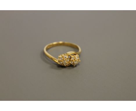 An 18ct gold double cluster ring