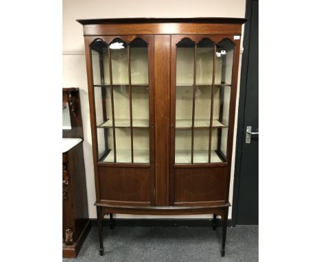 An Edwardian inlaid mahogany display cabinet