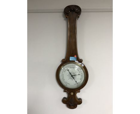 A carved mahogany banjo barometer 