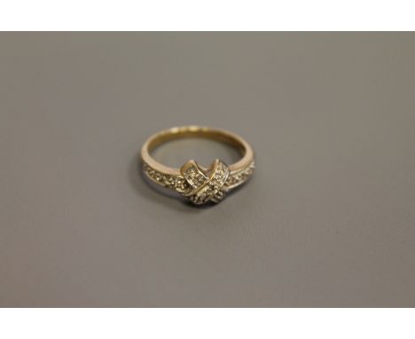 A 9ct gold diamond set ring, size M