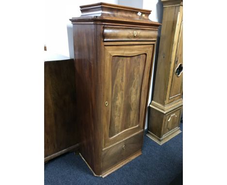 An early 20th century mahogany pillar cabinet 