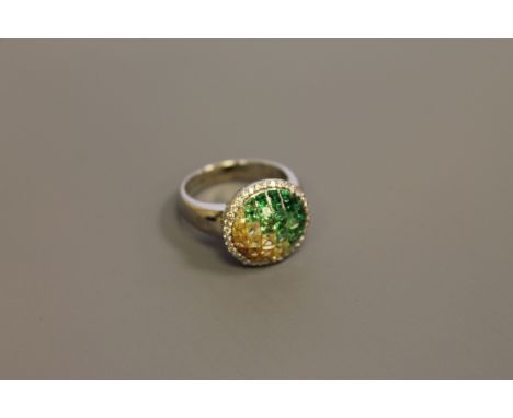 An 18ct gold chameleon ring set with diamonds and semi-precious stones