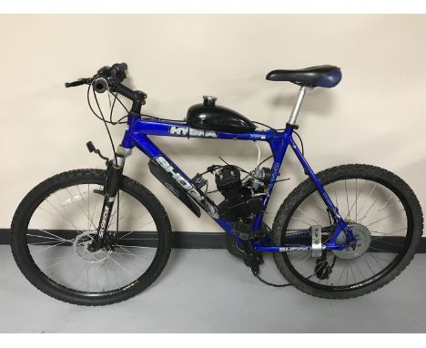 A gent's Shogun Hydra mountain bike fitted with an engine and a petrol tank 