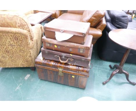 Vintage leather suitcases and metal travel truck