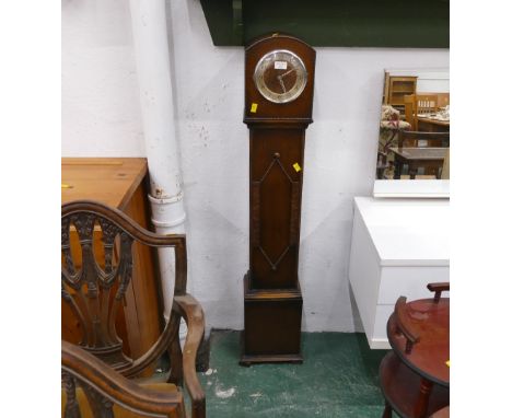 Oak cased granddaughter clock with key and pendulum, height 129 cm 
