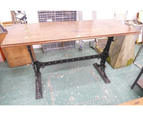 Rectangular mahogany table with cast iron base, height 77 cm, length 126 cm, depth 51 cm 