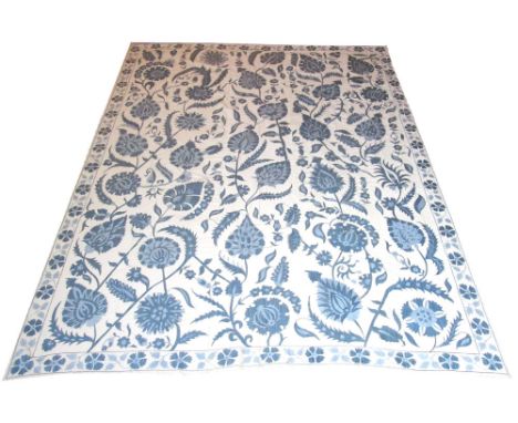 SILK SUZANI CARPET, 292cm x 233cm, William Morris design of palmettes and scrolling vines in sky blue. 