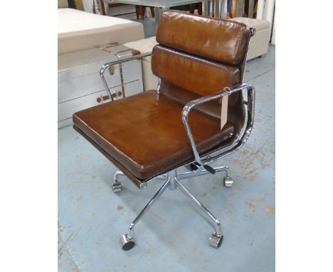 REVOLVING DESK CHAIR, Charles Eames, design tan leather cushioned seat revolving and reclining on an adjustable base with cas