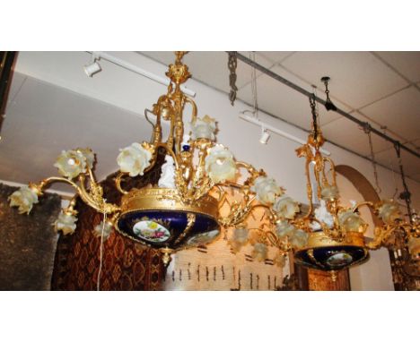 SEVRES STYLE CHANDELIERS, a pair, ornate gilt metal and ceramic each with four triple lights issuing from central girdle, eac
