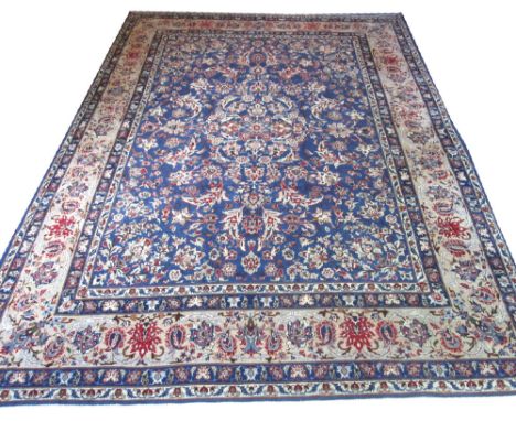 NESAFABAD CARPET, 380cm x 304cm, all over design of palmettes and scrolling vines on a powder blue field inside a correspondi