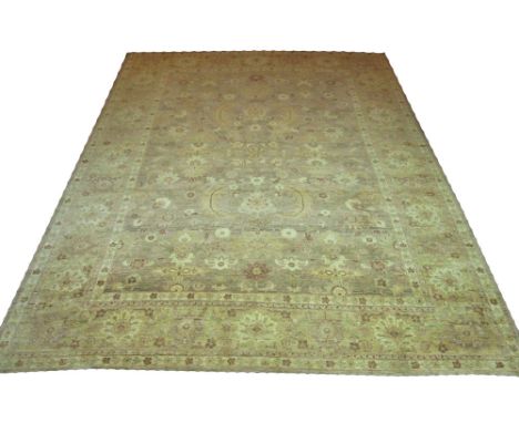 ZIEGLER CARPET, 415cm x 305cm, all over palmette, vine and foliage design on an abrashed field inside a repeat palmette borde