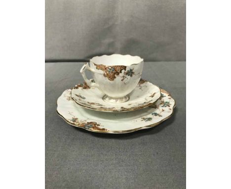 HAND PAINTED PART TEA SET comprising twelve side plates, twelve saucers, seven tea cups, cake plate, sugar and milk