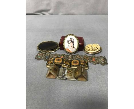 SMALL LOT OF COSTUME JEWELLERYcomprising three Persian bangles, ivory floral brooch, agate brooch and ceramic portrait brooch