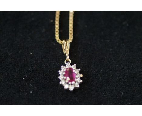 9ct Gold pendant &amp; chain set with central ruby surrounded by diamonds 
