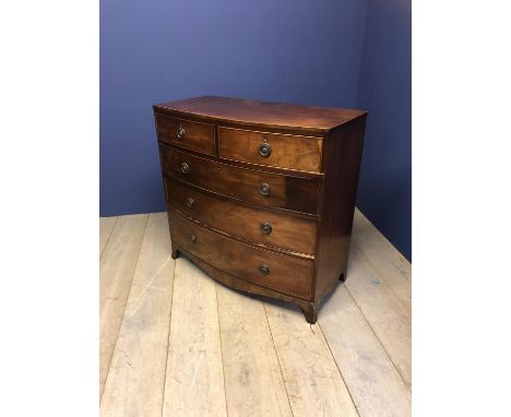 Late Regency mahogany bow front chest of 2 short over 3 long drawers, with ring handles on splayed bracket feet, 105cm Long, 