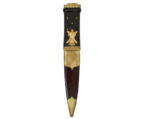 11.25cm fullered blade with faceted back edge, characteristic carved basket weave wooden hilt set with brass studs and applie